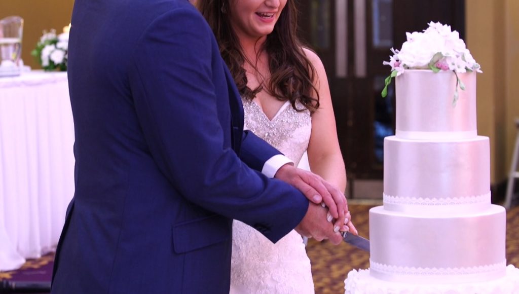 bride and groom cutting wedding cake in ballybofey