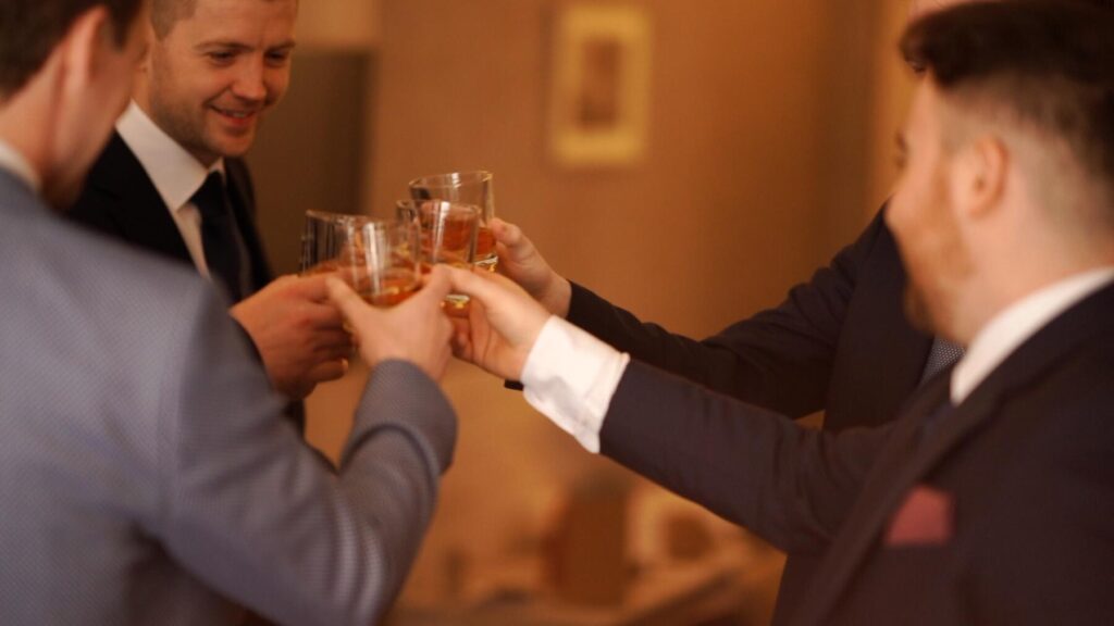 Donegal Town Wedding Videographer Jason McGarrigle video of groom and groomsmen with whiskey in Mill Park Hotel