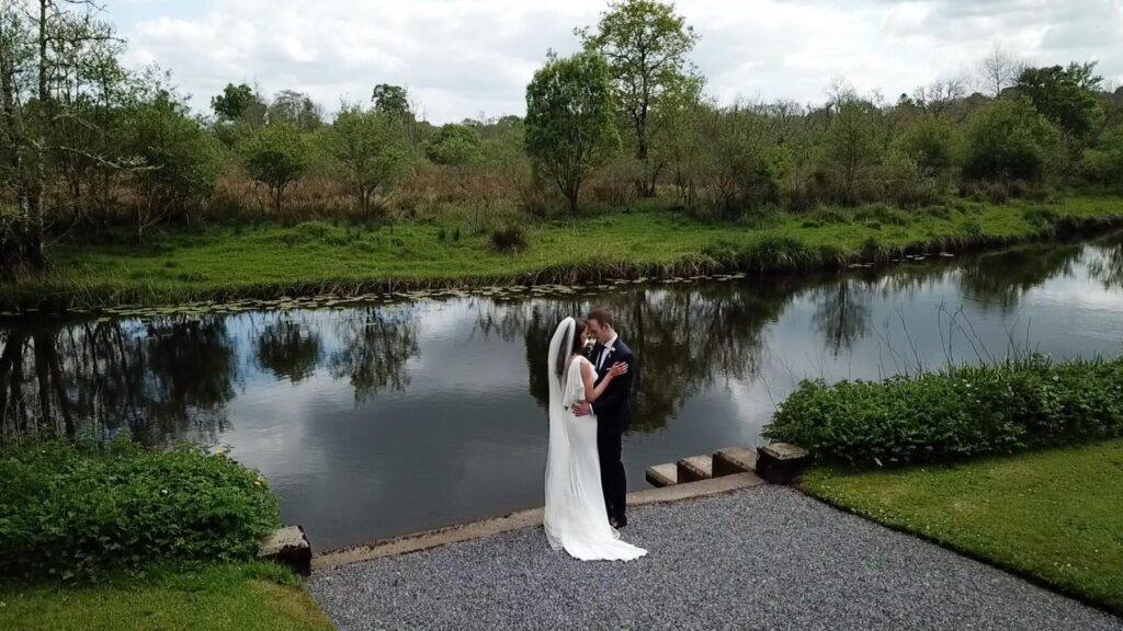 Markree Castle Wedding Video still with the bride and groom exploring the grounds in Sligo