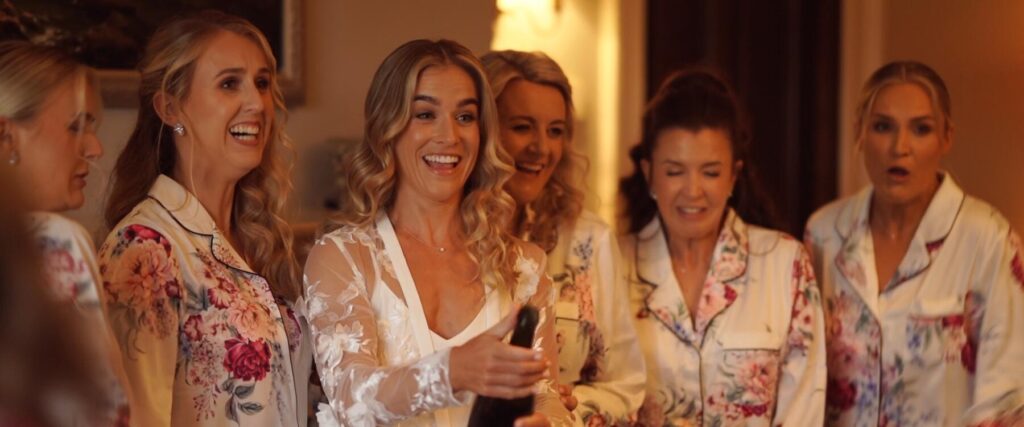 mayo bride sarah pops champagne with bridesmaids