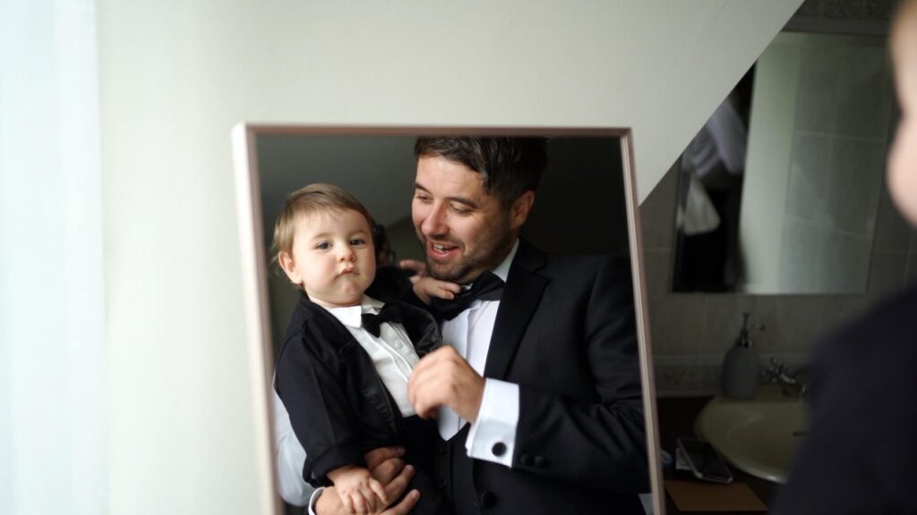 Groom and toddler get ready on the wedding day