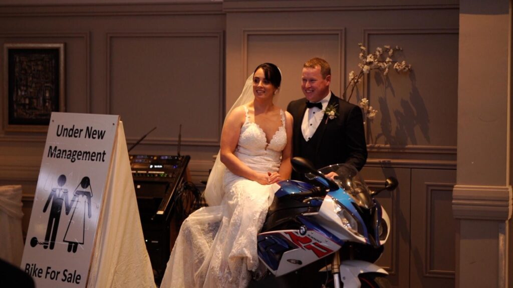 bride and groom on motorbike
