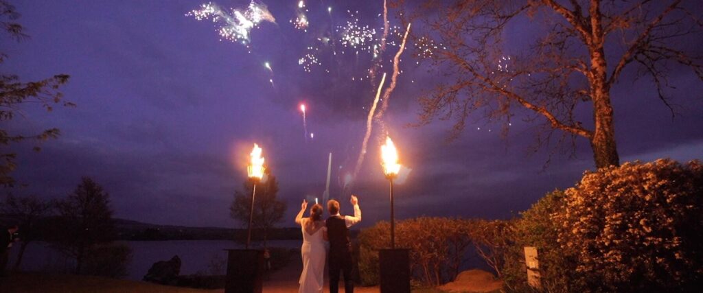 wedding fireworks on the pier in harveys point in this wedding film by videographer Jason McGarrigle